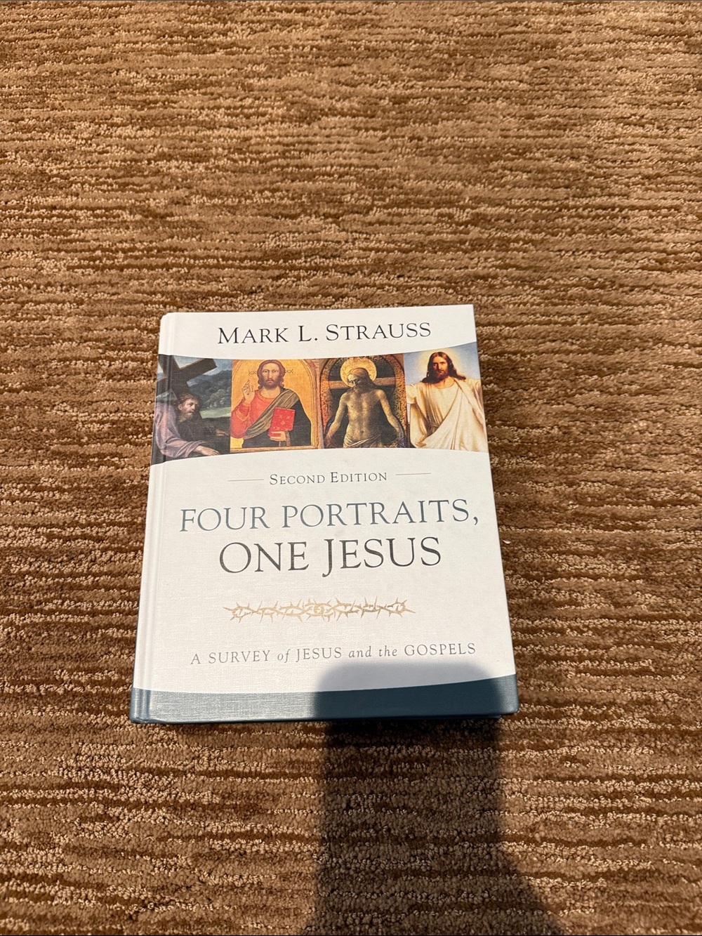 Four Portraits, One Jesus by Mark L. Strauss — White & Blue Cover